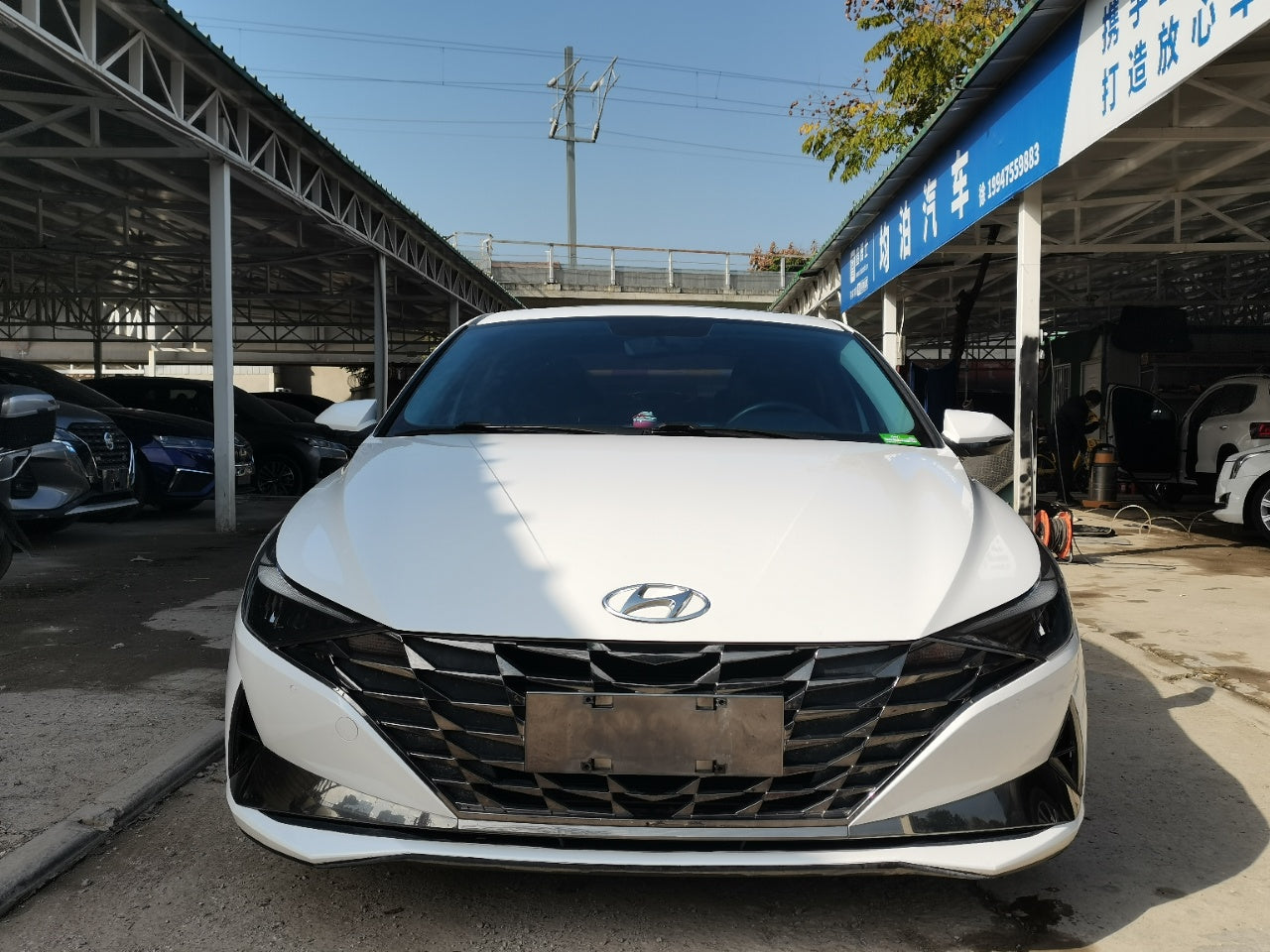 Hyundai Elantra 2022 передний вид · решётка радиатора